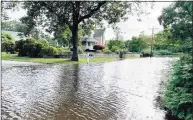  ?? Sarah Kyrcz / For Hearst Connecticu­t Media ?? West Wharf Beach in Madison and the entrance to the Surf Club and part of the Madison Country Club golf course are flooded following Ida.