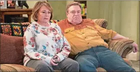  ?? ADAM ROSE/ABC VIA AP ?? Roseanne Barr, left, and John Goodman appear in a scene from the reboot of “Roseanne,” premiering on Tuesday at 8 p.m. EST.