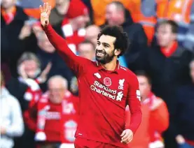  ?? Photo: AP ?? Liverpool’s Mohamed Salah celebrates scoring his side’s first goal of the game during the English Premier League soccer match between Liverpool and Fulham