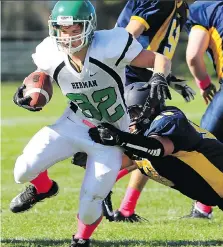  ?? NICK BRANCACCIO/FILES ?? Brody Quinn slips a tackle during high school football action at Windsor Stadium in 2015. Quinn suffered four concussion­s during his years in organized football and has had to give the game up.