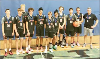  ?? Special to The Herald ?? Members of the Lake City Basketball U14 team with silver medals they won earlier this month at the Genesis Tournament in Calgary. From left: Graydon Kulak, Jude Splane, Julius Bartkowicz, Mateo Ducheck, Balkaran Lidhar, Liam Reid, Jasdeep Dhaliwal, Jonah Colley, Miller Jurcic, Mhyles Postnikoff and coach Russ Reid.