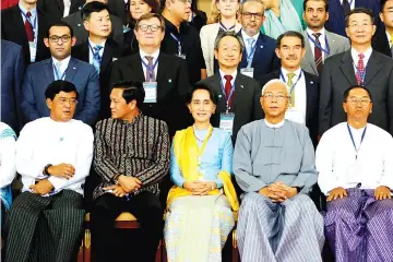  ?? — Reuters photo ?? Suu Kyi (seated centre) and Myanmar’s president Htin Kyaw (seated second right) pose for photo after the opening ceremony of 21st Century Panglong conference in Naypyitaw, Myanmar.