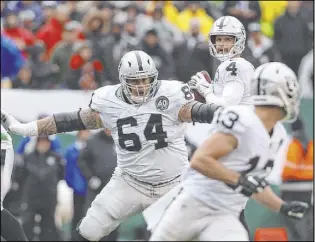  ?? Heidi Fang Las Vegas Review-Journal @HeidiFang ?? With the Raiders having an outside shot at the No. 6 seed in the AFC playoffs, quarterbac­k Derek Carr (4) sure could use offensive lineman Richie Incognito (64) back from an ankle injury that has him officially listed as doubtful.