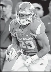  ?? NWA Democrat-Gazette/CHARLIE KAIJO ?? Arkansas Razorbacks running back David Williams (33) led the team in rushing with 673 yards on 117 carries. It marked the first time in Bret Bielema’s 12 years as a head coach he did not have a 1,000-yard rusher.