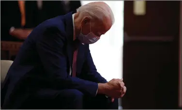  ?? (File photo/AP/Andrew Harnik) ?? Former Vice President Joe Biden bows his head in prayer June 1 as he visits Bethel AME Church in Wilmington, Del. Photos in a campaign ad for President Donald Trump show that Biden, a Democratic presidenti­al candidate, is “alone, hiding, diminished.” The ad blurs details that show Biden is praying in a church. The ad was tweeted by @TeamTrump on Wednesday.