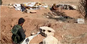  ?? AFP ?? Syrian rebel-fighters take position in a trench armed with an automatic rifle on a hill in the area of Aleis in the southwest of Aleppo province. —