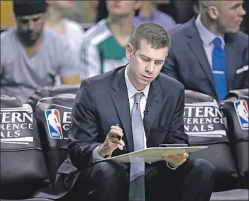  ?? Charles Krupa Associated Press ?? CELTICS COACH Brad Stevens sometimes will call time late in the shot clock if he doesn’t like what he sees.