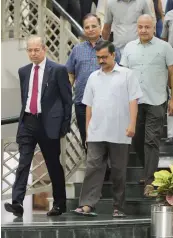  ?? — PTI ?? DERC’s new chairperso­n Satyendra Singh Chauhan ( left) with CM Arvind Kejriwal, his deputy Manish Sisodia and power minister Satyendar Jain at Delhi Secretaria­t in New Delhi on Thursday.