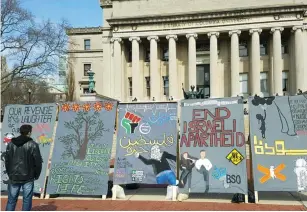  ??  ?? POSTERS FOR Israel Apartheid Week are seen at Columbia University in New York.