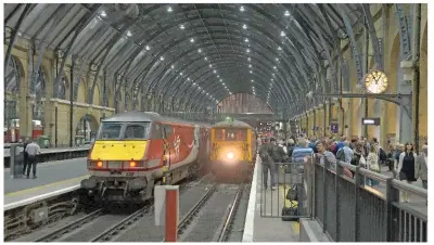  ?? DAVID STAINES. ?? The first ever Class 73s to visit King’s Cross on a passenger train, and still showing their Southern Region headcode blinds as unrebuilt examples, GB Railfreigh­t 73213 Rhodalyn and 73128OVS Bulleid CBE have just arrived with the GB15 charter from...