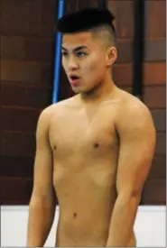  ?? JON BEHM — THE MORNING JOURNAL ?? Westlake senior Kenny Henry focuses prior to a dive at the Division I boys state competitio­n on Feb. 24.