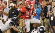  ?? John Bazemore / The Associated Press ?? Georgia’s Nick Chubb runs downfield Saturday against Samford.