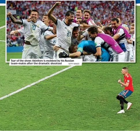  ?? GETTY IMAGES ?? Tsar of the show: Akinfeev is mobbed by his Russian team-mates after the dramatic shootout