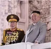  ??  ?? North Korean leader Kim Jong Un, right, warned Saturday that his country would ‘forcefully mobilize’ its nuclear force if threatened as he took center stage at the massive military parade