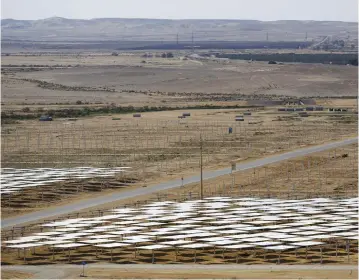 ?? (Reuters) ?? HELIOSTAT MIRRORS are seen during the constructi­on of a solar-power field in the Negev last year.