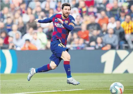  ?? REUTERS ?? Barcelona’s Lionel Messi scores a goal against Eibar in the Spanish league on Saturday.