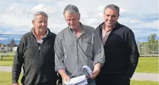  ?? PHOTO: ALEXIA JOHNSTON ?? Finer details . . . Omakau Recreation Reserve committee members (from left) Ross Naylor, chairman Ralph Milne and Colin Stevenson review the feasibilit­y study report for the town’s proposed community hub.