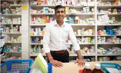  ?? Photograph: Stefan Rousseau/PA ?? Rishi Sunak visiting his family's former pharmacy in Southampto­n.