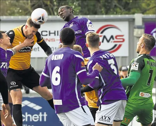  ?? Picture: Steve Terrell ?? Sam Bone wins this aerial battle but Stones crashed out of the FA Trophy to Barnet on penalties