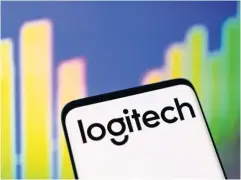  ?? REUTERS ?? The Logitech logo is seen in front of a stock graph.