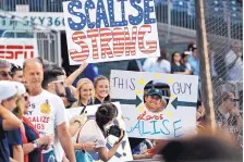  ?? ALEX BRANDON/ASSOCIATED PRESS ?? Supporters of House Majority Whip Steve Scalise, R-La., hold signs before the Congressio­nal baseball game Thursday in Washington. The annual GOP-Democrats matchup raises money for charity.