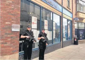  ??  ?? Police in Saddler Street in Durham city centre yesterday