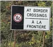  ?? JULIE JOCSAK THE ST. CATHARINES STANDARD ?? Signs along Highway 405 warn people not to take cannabis over the border into the U.S.