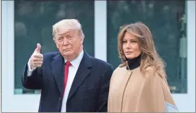  ?? Ap-alex Brandon ?? President Donald Trump, accompanie­d by first lady Melania Trump, gives thumbs up as he walks on the South Lawn as they depart the White House on Jan. 31. Trump is en route to his Mar-a-lago resort in Palm Beach, Fla.