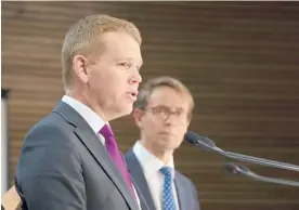  ?? Photo / Mark Mitchell ?? Health Minister Chris Hipkins and director general of health Dr Ashley Bloomfield.