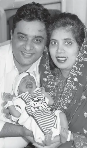  ?? ?? Mohammed and Saira Hafeez with Shiraz in 1996. Ref:133981-4