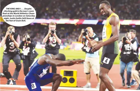  ??  ?? THE KING AND I . . . Despite clinching gold in the men’s 100m final at the World Athletics Championsh­ips in London on Saturday night, Justin Gatlin (left) bows at the feet of Usain Bolt.