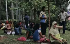  ??  ?? Refugees wait for access to the UN High Commission for Refugees building in Kuala Lumpur, Malaysia.