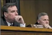  ?? The Associated Press ?? RUSSIA PROBE: Senate Intelligen­ce Committee Chairman Sen. Richard Burr, R-N.C., right, and Vice Chairman Sen. Mark Warner, D-Va., listen to testimony during a Senate Intelligen­ce Committee hearing on Capitol Hill in Washington, Thursday on Russian...