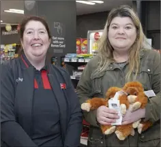  ??  ?? Helen Doyle with the very first customer at the tills – Jamie Barry from Mount Prospect.