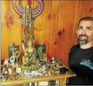  ?? PHOTO SPECIAL TO THE DISPATCH BY MIKE JAQUAYS ?? InnerVisio­n Crystals founder Michael Eggleston of Hamilton poses with some of his collection on Wednesday.