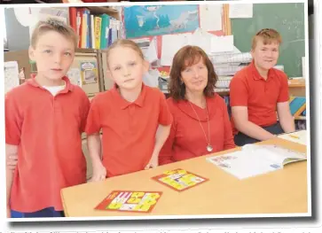  ??  ?? Pupils with Ann O’Hare who is retiring from her teaching post at Dulargy National School, Ravensdale after 28 years of service.