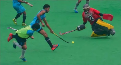  ??  ?? Action from a pool match of the 25th Nehru all- India inter- university men’s hockey tournament at the Major Dhyan Chand National Stadium in New Delhi on Monday.