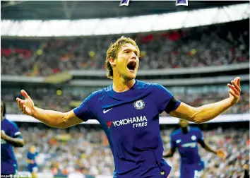  ?? — Mailonline. ?? MAKE MINE A DOUBLE . . . Chelsea’s Marcos Alonso celebrates after firing a late winner underneath the body of Tottenham goalkeeper Hugo Lloris in an English Premiershi­p soccer match at Wembley yesterday.