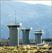  ?? CHRIS MCLEAN — THE PUEBLO CHIEFTAIN VIA AP ?? On Feb. 21, 2007, guard towers loom over the administra­tive maximum security federal prison called Supermax near Florence, Colo. Experts say the drug lord Joaquin “El Chapo” Guzman, who will be sentenced on June 25, 2019, for smuggling enormous amounts of narcotics into the U.S and having a hand in dozens of murders, seems the ideal candidate for “Supermax” prison also known as ADX for “administra­tive maximum,” a facility so secure, so remote and so austere that it has been called the “Alcatraz of the Rockies.”