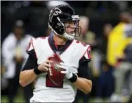  ?? BUTCH DILL — THE ASSOCIATED PRESS FILE ?? Falcons quarterbac­k Matt Ryan (2) drops back to pass in the first half of an NFL football game against the Saints in New Orleans. Ryan and the Falcons will meet the Rams in Los Angeles in the wild-card round Saturday (8:15 p.m.).