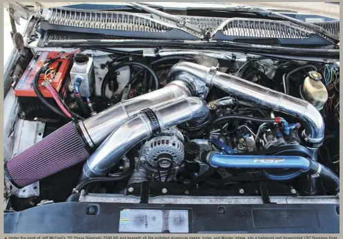  ??  ?? Under the hood of Jeff Mccord’s ’02 Chevy Silverado 2500 HD and beneath all the polished aluminum piping, turbo, and Wagler intake, sits a balanced and blueprinte­d LB7 Duramax from Socal Diesel. Installed by the truck’s previous owner and with few expenses spared, it sports a girdle, ARP main studs, Carrillo rods, 0.020-inch overbore Mahle cast-aluminum pistons with 0.120-inch valve reliefs, a Socal #9100 standard firing order camshaft, and an O-ringed block. Socal’s Stage 2 heads, complete with 5-axis CNC porting, beehive valve springs with titanium retainers, and billet single-piece rocker bridges, anchor to the block via 14mm ARP head studs.