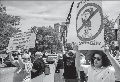  ?? MIKE MOORE/THE JOURNAL-GAZETTE VIA AP ?? Demonstrat­ors line up to protest U.S. Attorney General Jeff Sessions and immigratio­n reform at Parkview Field in Fort Wayne, Ind., on Thursday.