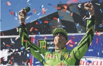  ?? DAILY PRESS VIA AP JAMES QUIGG/THE ?? Kyle Busch celebrates after winning the NASCAR Cup Series race Sunday at Auto Club Speedway in Fontana, Calif.