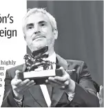  ??  ?? Director Alfonso Cuaron with the Golden Lion for ‘Roma' at the 75th Venice Film Festival on Sept 8, 2018. — Relaxnews photo