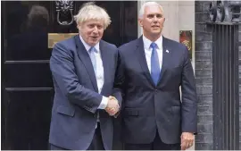  ??  ?? British Prime Minister Boris Johnson (left), greets U.S. Vice President Mike Pence at 10 Downing Street in London, Britain, on September 5, 2019.