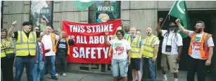  ?? (Neil Hall/Reuters) ?? MEMBERS OF THE National Union of Rail, Maritime and Transport Workers picket at Victoria Station in London yesterday.