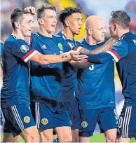  ??  ?? The camaraderi­e in the Scotland squad is clear