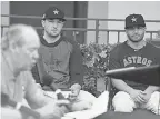  ??  ?? Alex Bregman and Jose Altuve listen as owner Jim Crane speaks Thursday. JIM RASSOL/ USA TODAY SPORTS