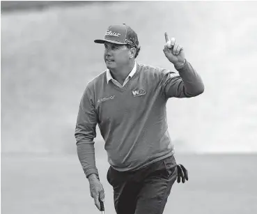  ?? [AP PHOTO] ?? Charley Hoffman waves to the crowd after making a putt on the 16th hole during Thursday’s first round at the Masters.