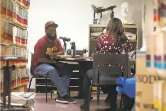  ?? Liz Hafalia / The Chronicle ?? Earlonne Woods and Nigel Poor, cohosts of “Ear Hustle,” record a podcast at The Chronicle. They started their popular podcast while Woods was a prisoner in San Quentin.